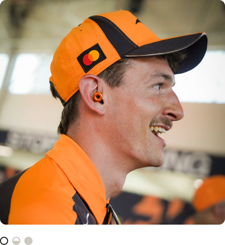 Man with McLaren F1 Team outfit wearing Loop Switch 2 at event