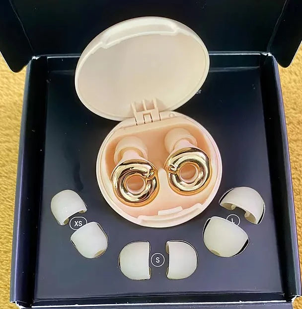 Loop Switch 2 earplugs in gold color, in packaging with extra ear tips